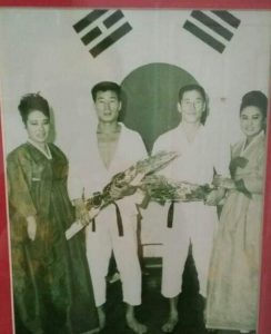 Yoosun Lee and Bok Man Kim receiving flowers at an event in Korea